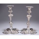 A PAIR OF BAROQUE REVIVAL SILVER-PLATED CANDLESTICKS