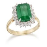 AN 18 CARAT GOLD EMERALD AND DIAMOND CLUSTER RING