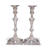 A PAIR OF GEORGE III CAST SILVER CANDLESTICKS