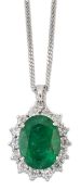 AN 18 CARAT WHITE GOLD EMERALD AND DIAMOND CLUSTER PENDANT ON CHAIN