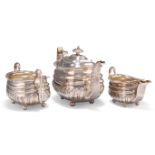 A GEORGE III SILVER THREE-PIECE TEA SERVICE