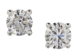 A PAIR OF SOLITAIRE DIAMOND EARRINGS