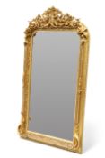 A PERIOD-STYLE GILT-COMPOSITION MIRROR