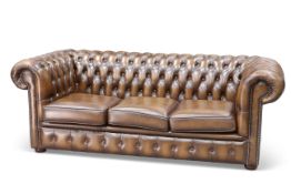 A CHESTERFIELD DEEP-BUTTONED BROWN LEATHER SOFA