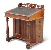 A VICTORIAN MAHOGANY DAVENPORT