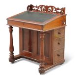 A VICTORIAN MAHOGANY DAVENPORT