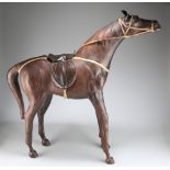 A LARGE VINTAGE LEATHER-COVERED MODEL OF A HORSE