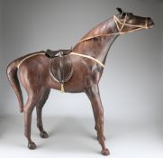 A LARGE VINTAGE LEATHER-COVERED MODEL OF A HORSE