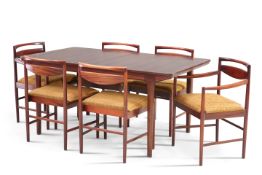 A MCINTOSH HARDWOOD EXTENDING DINING TABLE AND SIX CHAIRS