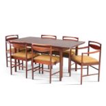 A MCINTOSH HARDWOOD EXTENDING DINING TABLE AND SIX CHAIRS