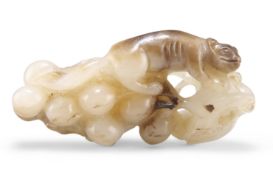 A CHINESE JADE CARVING OF A SQUIRREL AND GRAPES GROUP