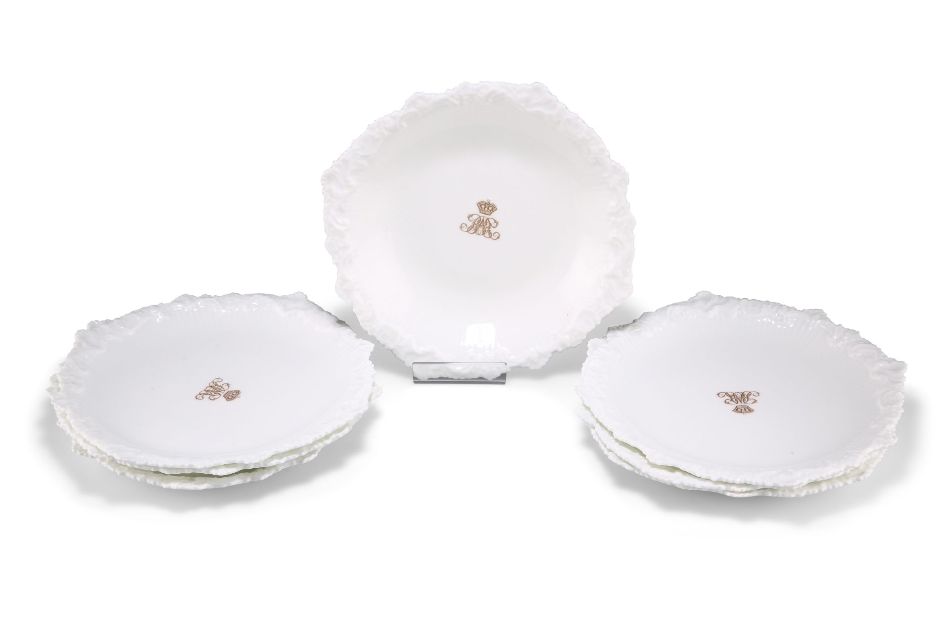 SIX CAULDON CHINA CRESTED DESSERT PLATES AND A DISH, CIRCA 1885