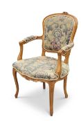 A LOUIS XV-STYLE BEECH AND UPHOLSTERED FAUTEUIL