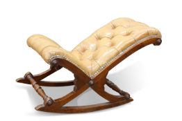 A GEORGIAN-STYLE LEATHER UPHOLSTERED ROCKING FOOTSTOOL