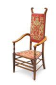 AN ARTS AND CRAFTS MAHOGANY AND UPHOLSTERED ARMCHAIR, ATTRIBUTED TO J.S HENRY