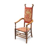 AN ARTS AND CRAFTS MAHOGANY AND UPHOLSTERED ARMCHAIR, ATTRIBUTED TO J.S HENRY