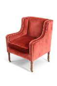 A LATE REGENCY MAHOGANY AND UPHOLSTERED LIBRARY ARMCHAIR