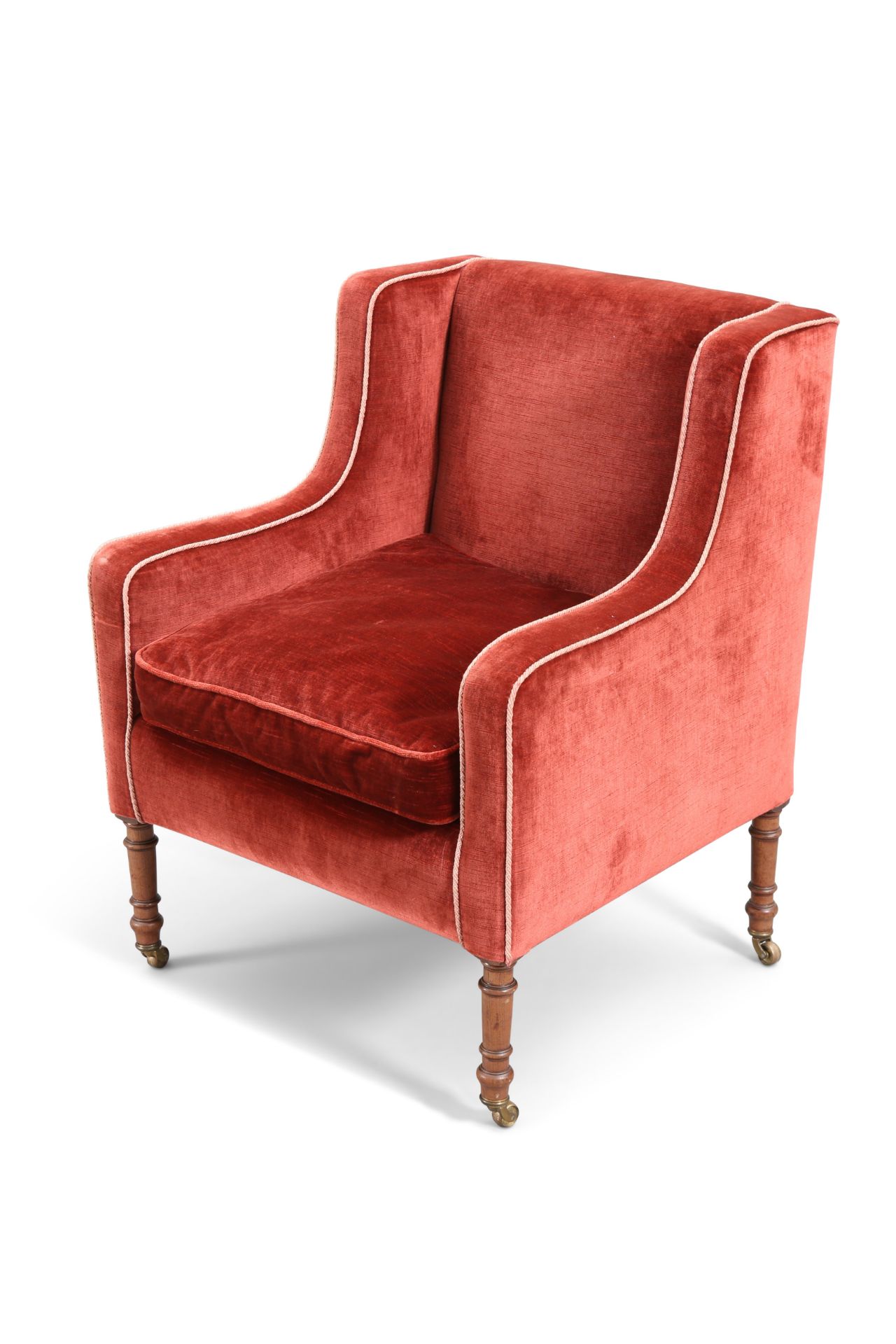 A LATE REGENCY MAHOGANY AND UPHOLSTERED LIBRARY ARMCHAIR