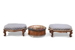 A PAIR OF VICTORIAN WALNUT AND UPHOLSTERED FOOTSTOOLS