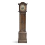 AN EARLY 20TH CENTURY OAK THREE-TRAIN GRANDMOTHER CLOCK