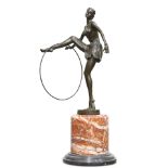 AN ART DECO-STYLE BRONZE FIGURE OF A HOOP DANCER