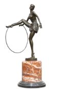 AN ART DECO-STYLE BRONZE FIGURE OF A HOOP DANCER