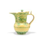 A CHINESE MING-STYLE YELLOW-GLAZED 'MONKS CAP' EWER