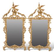 A PAIR OF ROCOCO-STYLE GILTWOOD MIRRORS