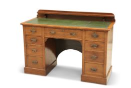 AN EDWARDIAN OAK DESK