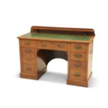 AN EDWARDIAN OAK DESK