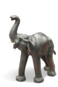 A LARGE VINTAGE LEATHER-COVERED MODEL ELEPHANT