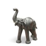 A LARGE VINTAGE LEATHER-COVERED MODEL ELEPHANT