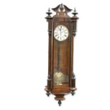 A GERMAN EBONISED AND WALNUT VIENNA-PATTERN WALL CLOCK