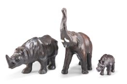 TWO LEATHER RHINOS AND A LEATHER ELEPHANT