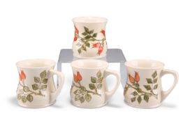 A SET OF FOUR MOORCROFT POTTERY MUGS