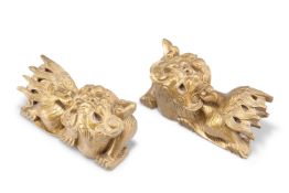 A PAIR OF 19TH CENTURY CHINESE GILTWOOD CARVINGS OF FU DOGS