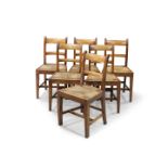 A SET OF SIX 19TH CENTURY COUNTRY BEECH AND RUSH SEATED DINING CHAIRS