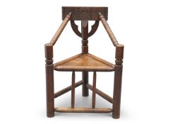 A 19TH CENTURY OAK TURNER'S CHAIR OF CHARACTERISTIC FORM