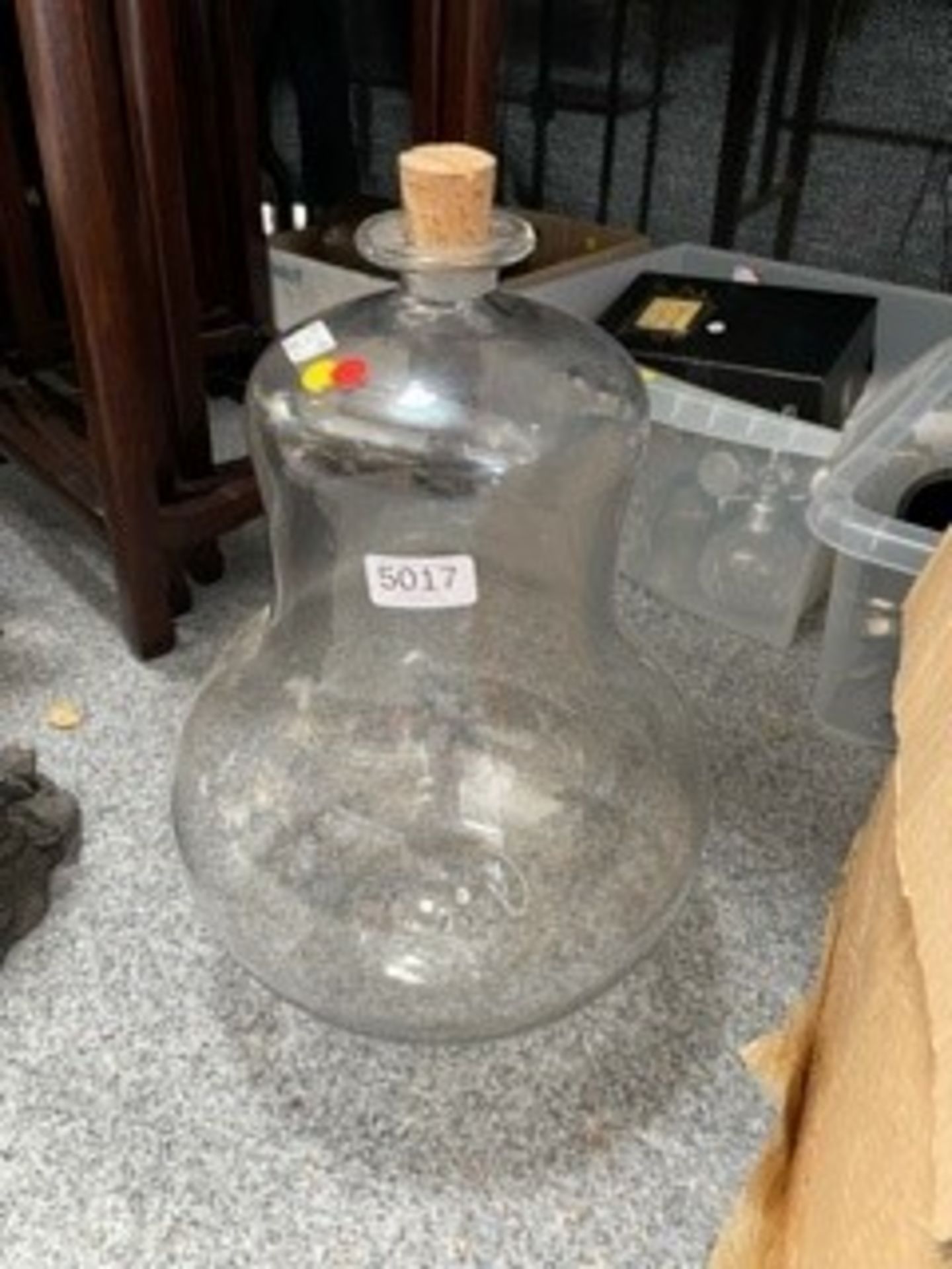 A large clear glass bottle