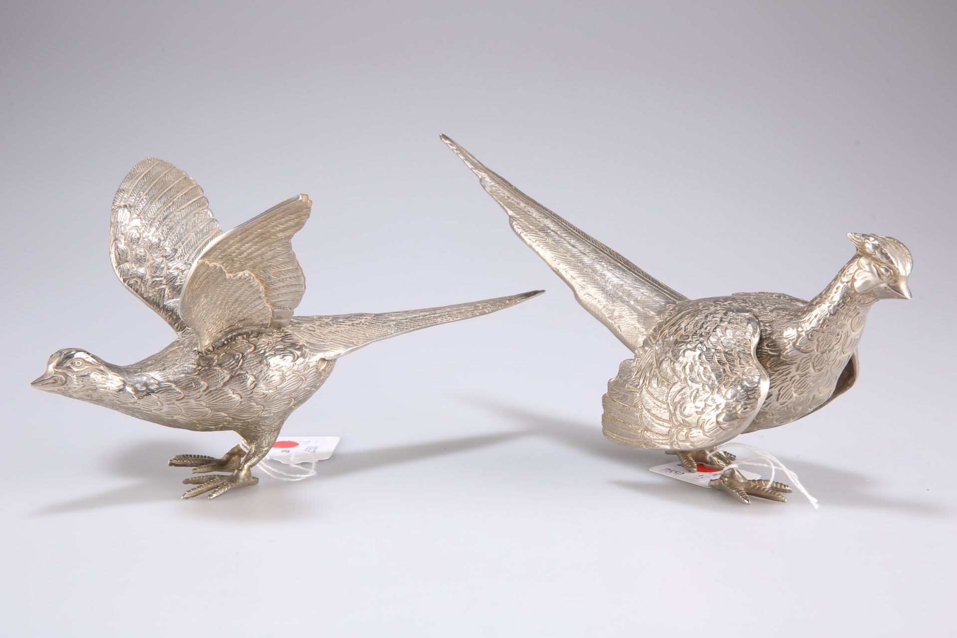 A pair of silver-plated pheasants