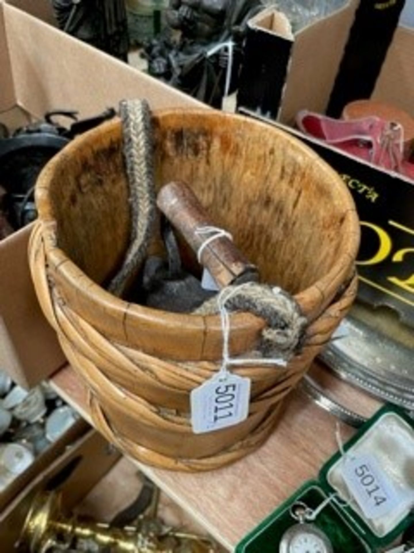 A 19th century cane bound wooden milk pail; and a 19th century coal filled iron