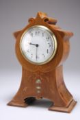 An Edwardian inlaid mahogany mantel clock