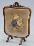 A 19th Century mahogany and needlework firescreen