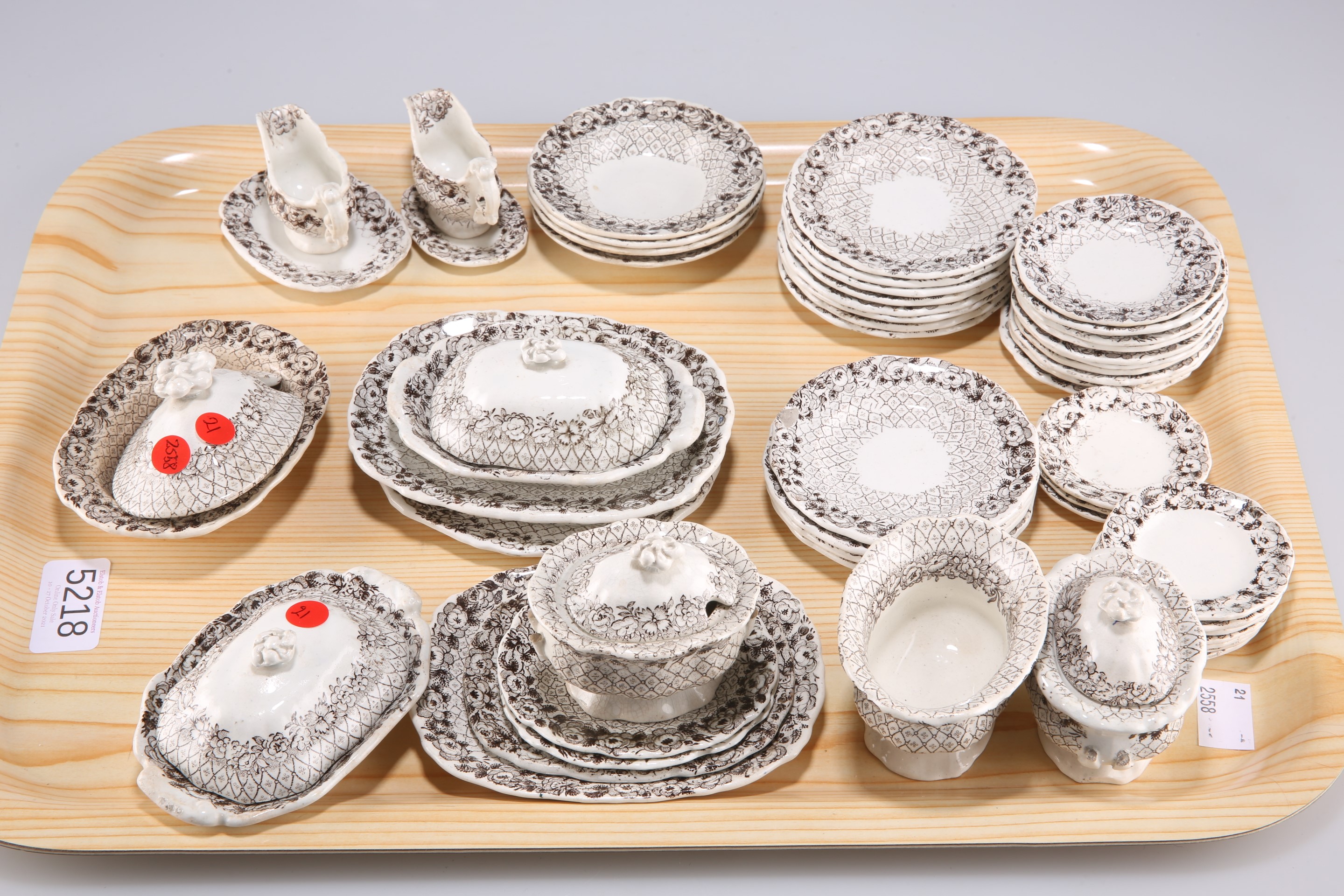 A late 19th Century English pottery child’s tea service, transfer printed in brown, comprising