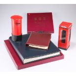 An Asprey’s leather-bound loose-leaf address book, 18cm by 15cm boxed, a photograph album, boxed,