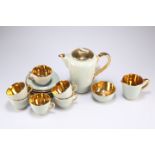A Jersey pottery sage green and gold coffee set for six