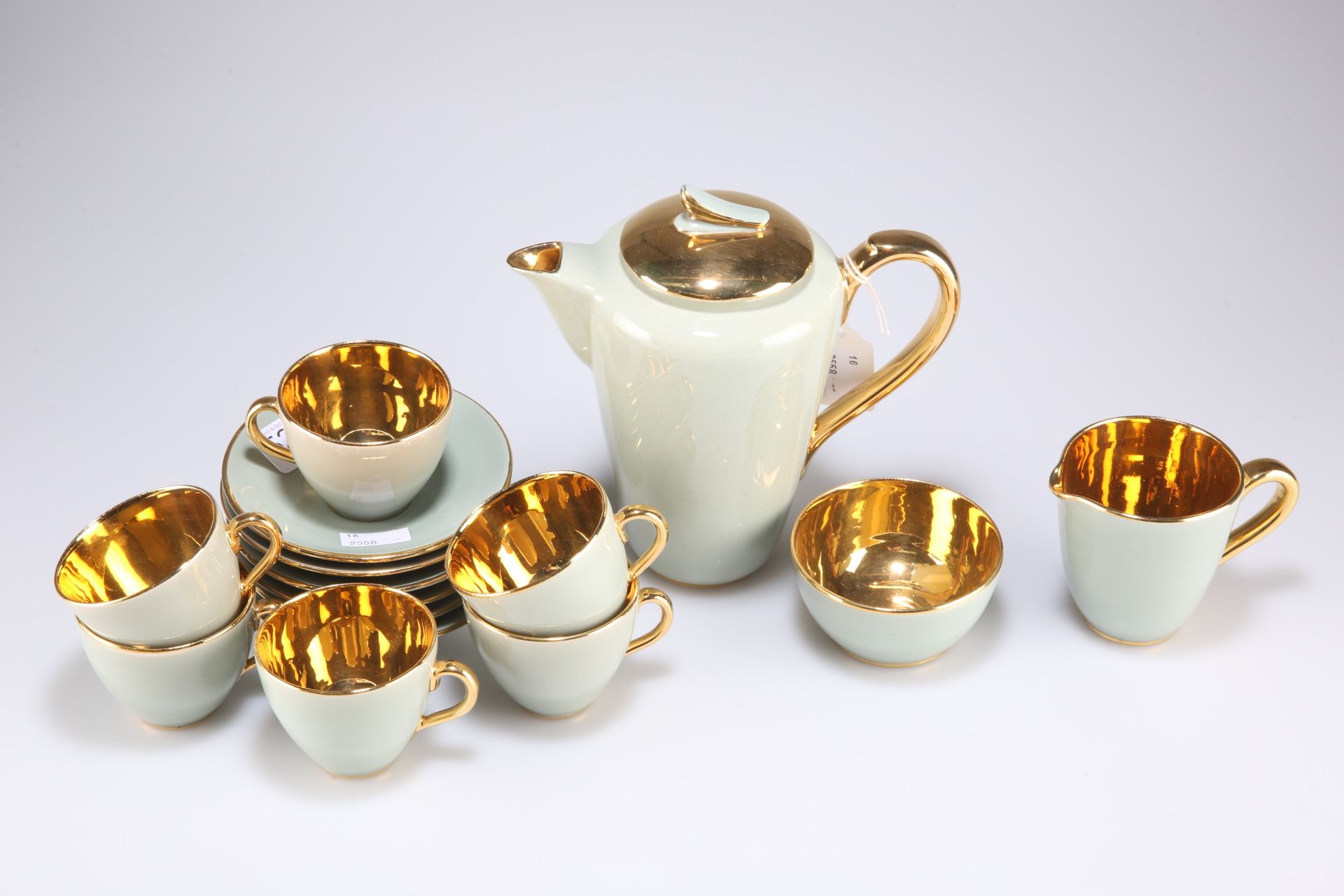 A Jersey pottery sage green and gold coffee set for six