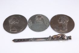 After Jules Moigniez, patinated bronze novelty letter opener and three medallions