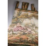 A large machine made tapestry wall hanging depicting figures in a landscape by a mill, 230cm by