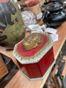 A Victorian cast iron tobacco box, with a laughing mask cover